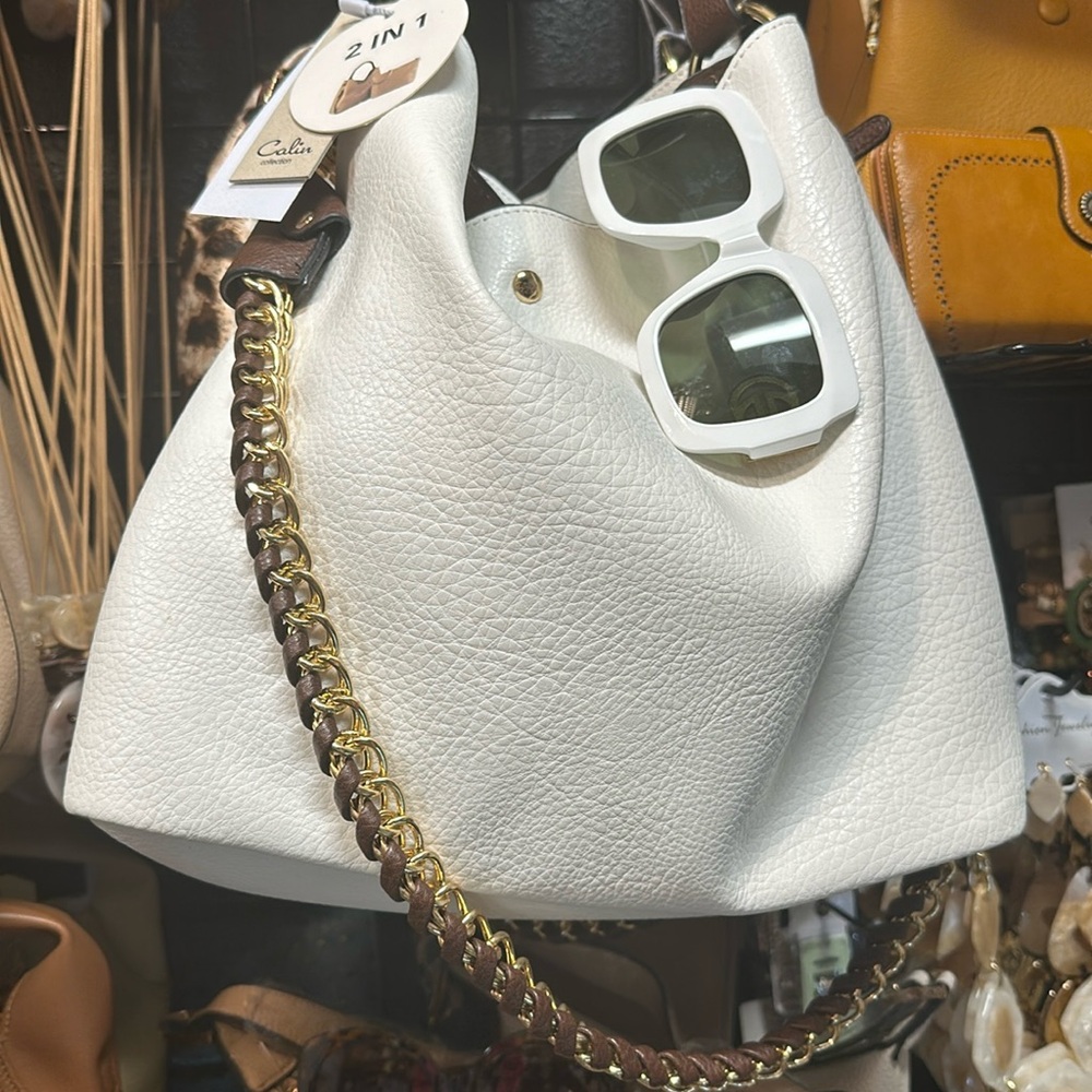 This purse has 2 in-1 pouch chain strap and also a short strap oversized